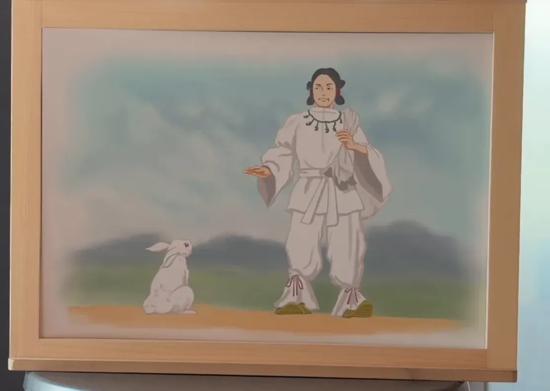 白い衣の神と白いうさぎを描いた紙芝居の絵